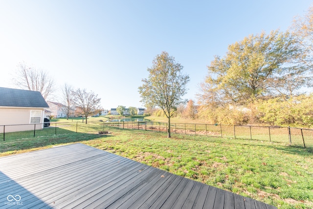 wooden deck featuring a yard and a rural view