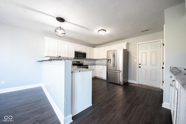 kitchen featuring stainless steel appliances, a textured ceiling, decorative light fixtures, white cabinets, and dark hardwood / wood-style flooring