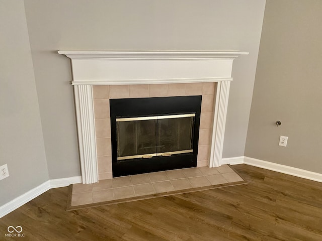 details featuring a fireplace and hardwood / wood-style flooring