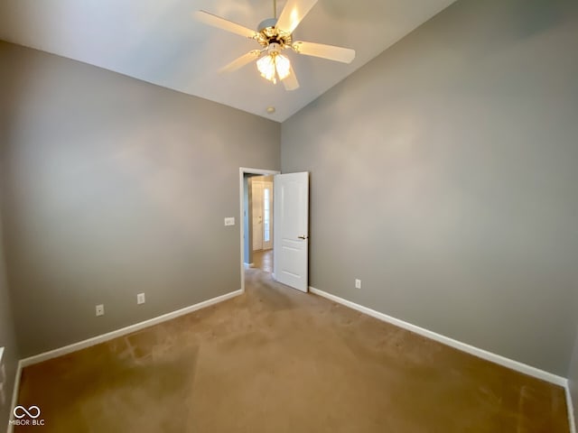 unfurnished bedroom with vaulted ceiling, ceiling fan, and carpet floors