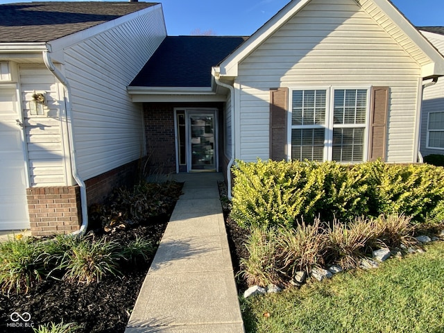 doorway to property featuring a garage