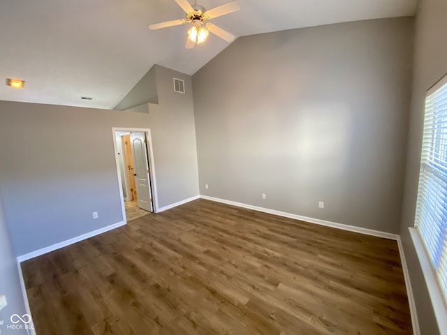 unfurnished bedroom featuring dark wood-type flooring, ceiling fan, and lofted ceiling