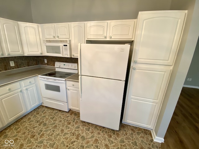 kitchen with white cabinets, white appliances, and decorative backsplash