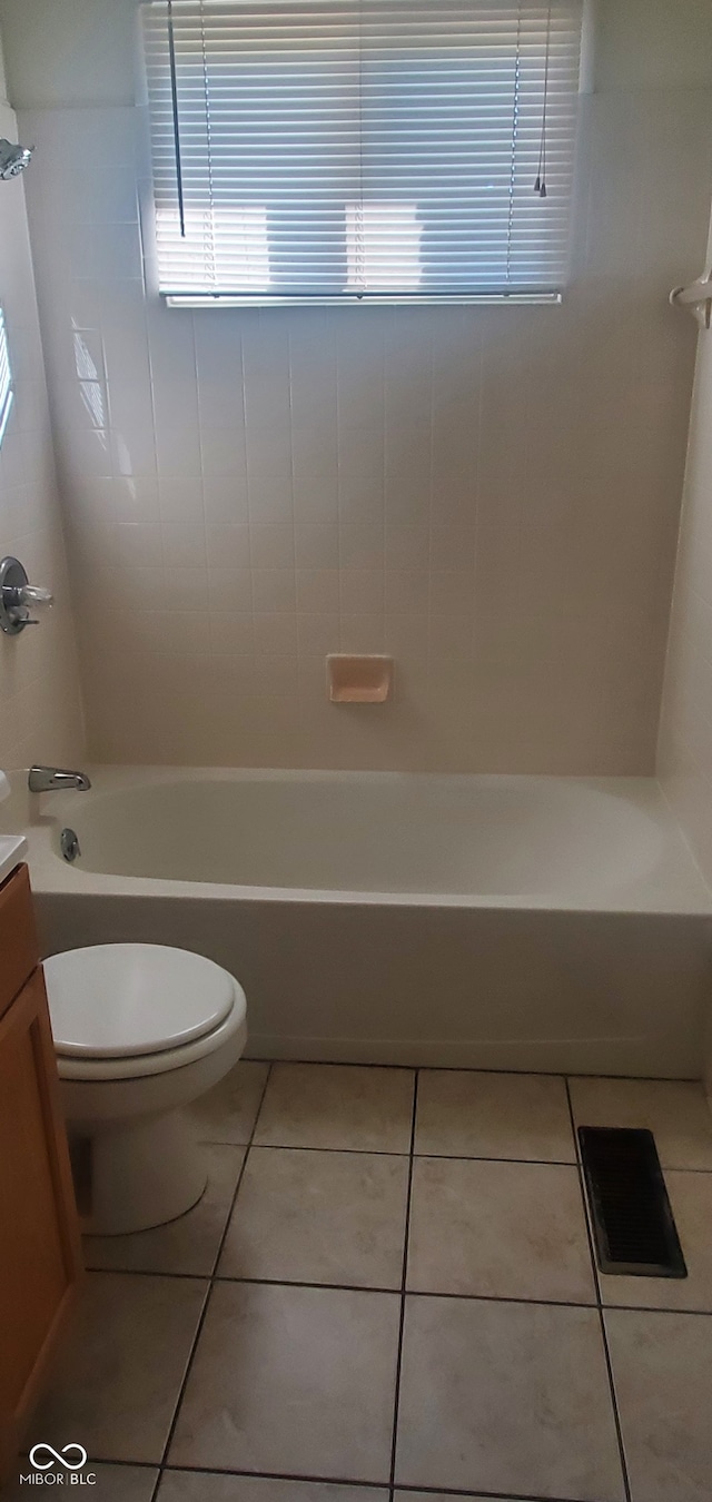 full bathroom with toilet, vanity, tile patterned flooring, and  shower combination