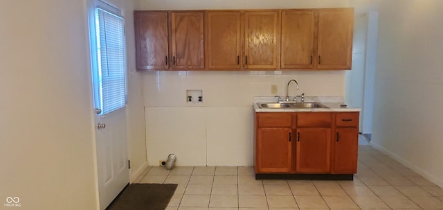 kitchen with sink and light tile patterned floors