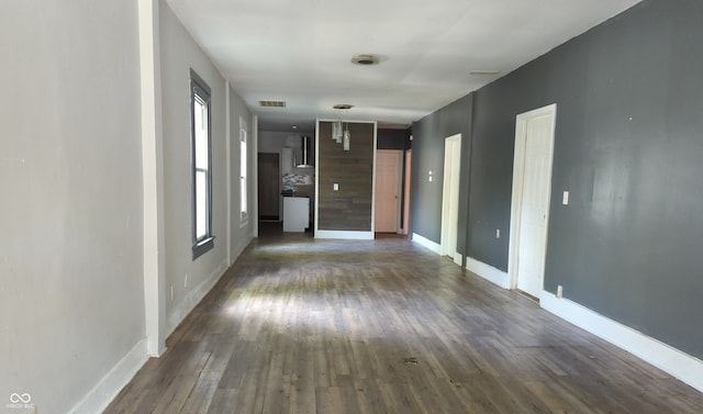 empty room featuring dark wood-type flooring