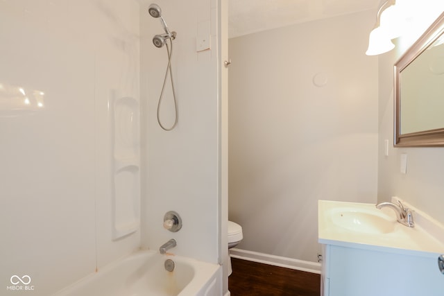 full bathroom featuring vanity, wood-type flooring, bathtub / shower combination, and toilet