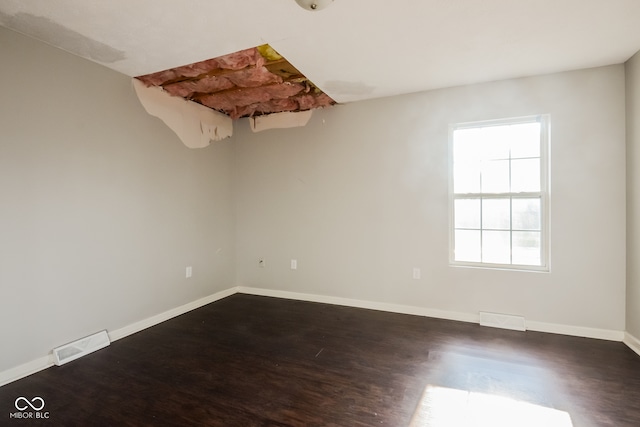 empty room featuring dark wood-type flooring