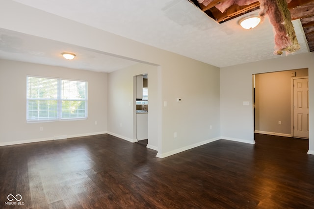 unfurnished room featuring dark hardwood / wood-style floors