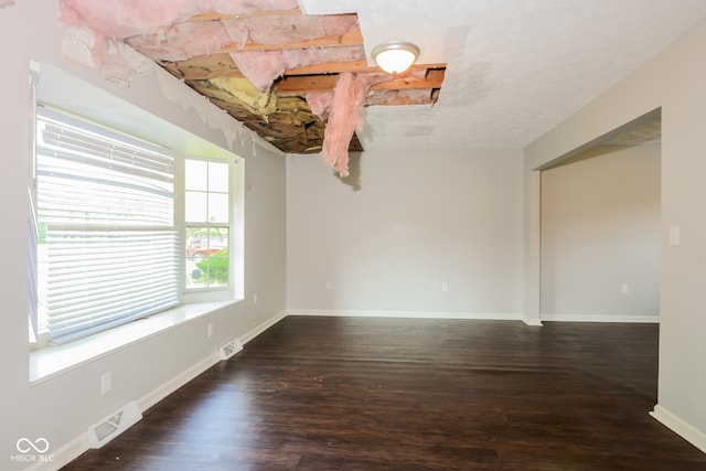 spare room with dark hardwood / wood-style flooring