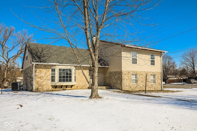 5060 Staughton Dr, Indianapolis, IN 46226 - view of front of property with stone siding and central AC unit