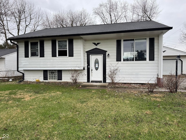 5625 Gateway Dr, Indianapolis, IN 46254 - bi-level home featuring a front lawn and a garage