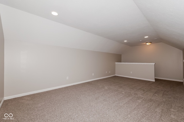 bonus room with carpet and lofted ceiling