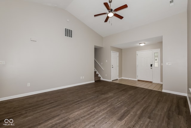 unfurnished living room featuring high vaulted ceiling, ceiling fan, and dark wood-type flooring