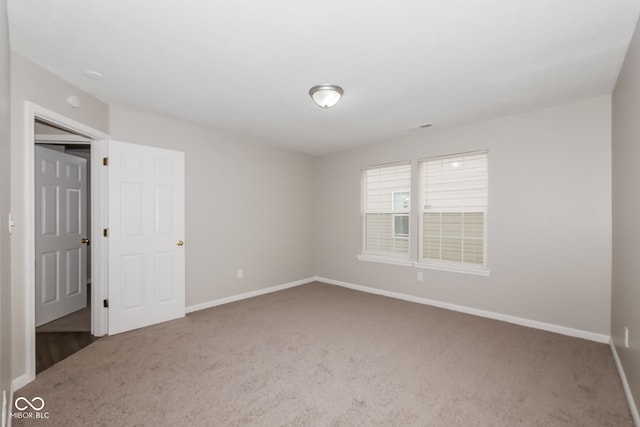 view of carpeted spare room