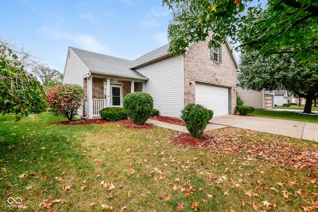 view of front of property featuring a garage and a front lawn