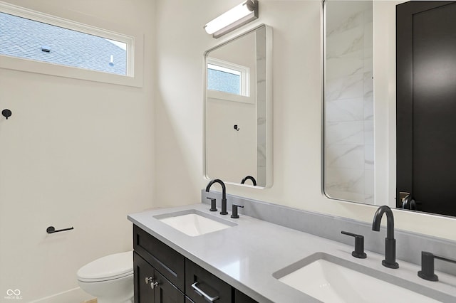 5469 Harness Dr, Greenwood, IN 46143 - bathroom featuring healthy amount of natural light, toilet, and double vanity