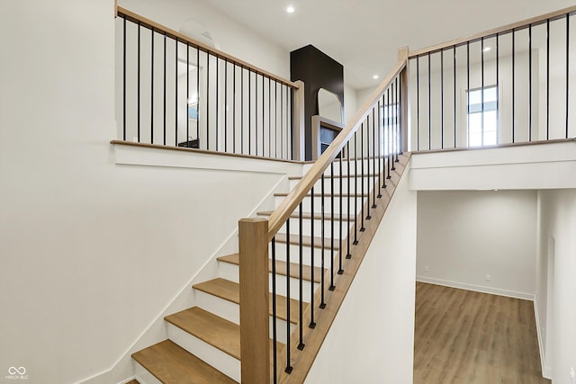 5469 Harness Dr, Greenwood, IN 46143 - stairway with recessed lighting, wood finished floors, and baseboards