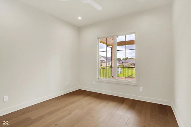5469 Harness Dr, Greenwood, IN 46143 - spare room with wood finished floors, baseboards, a ceiling fan, and recessed lighting