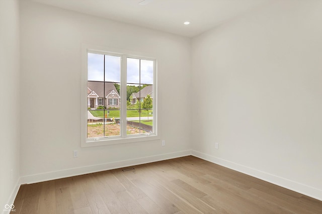 5469 Harness Dr, Greenwood, IN 46143 - empty room featuring baseboards, light wood-style floors, and recessed lighting