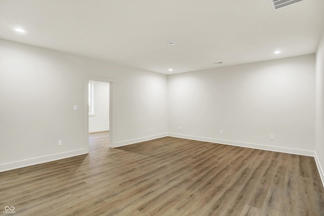 5469 Harness Dr, Greenwood, IN 46143 - spare room featuring recessed lighting, wood finished floors, and baseboards