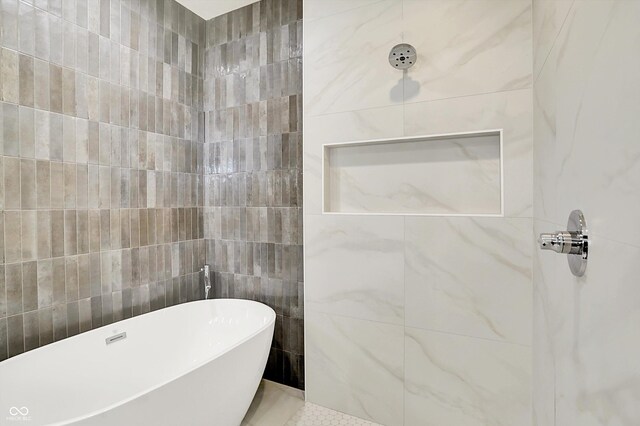 5469 Harness Dr, Greenwood, IN 46143 - full bath with tile walls, a soaking tub, and tiled shower