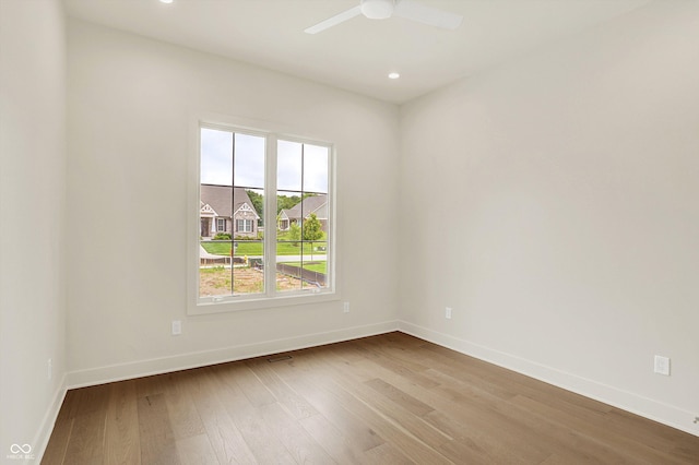 5469 Harness Dr, Greenwood, IN 46143 - empty room with baseboards, wood finished floors, recessed lighting, and ceiling fan