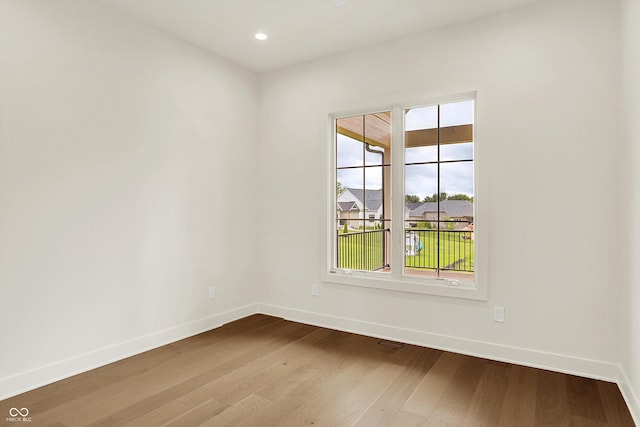 5469 Harness Dr, Greenwood, IN 46143 - spare room with baseboards, dark wood-style flooring, and recessed lighting