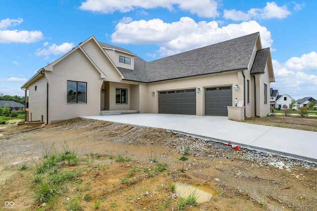 5469 Harness Dr, Greenwood, IN 46143 - view of front of home with a garage, driveway, a shingled roof, and brick siding