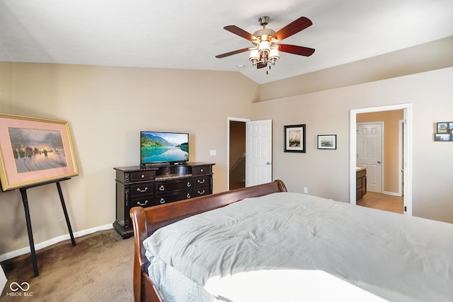 carpeted bedroom featuring vaulted ceiling, ceiling fan, and connected bathroom