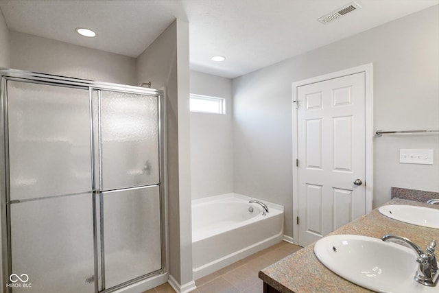 bathroom featuring vanity, tile patterned floors, and separate shower and tub