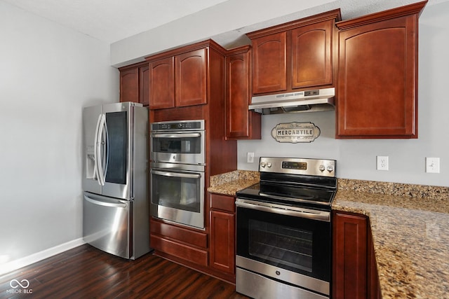 kitchen featuring light stone counters, appliances with stainless steel finishes, and dark hardwood / wood-style flooring