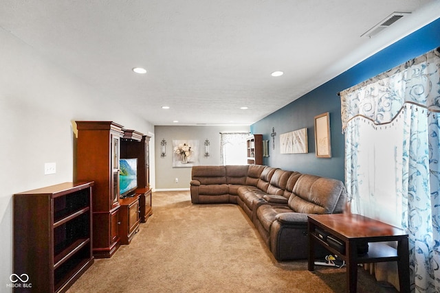 living room featuring light colored carpet