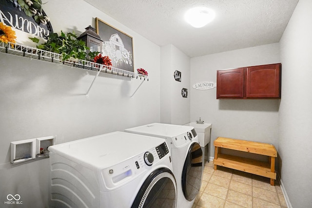 clothes washing area with a textured ceiling and independent washer and dryer