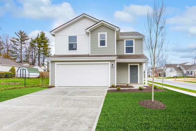 view of front of home featuring a garage and a front yard