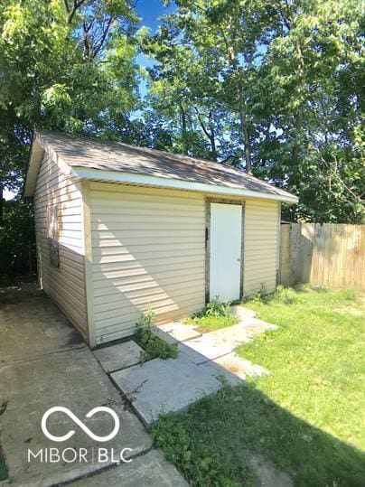 view of outbuilding featuring a yard