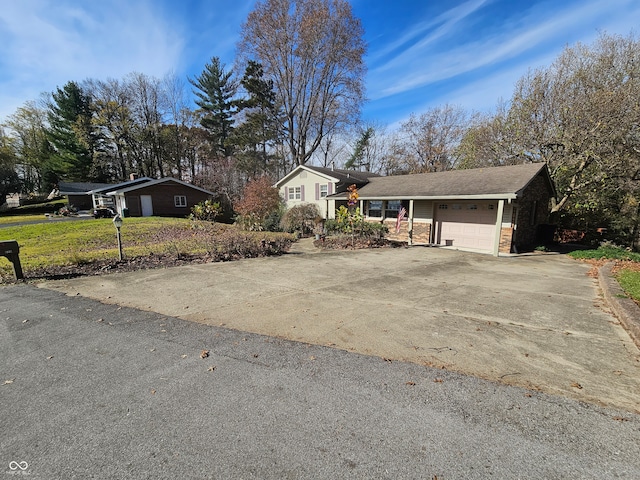 ranch-style house featuring a garage