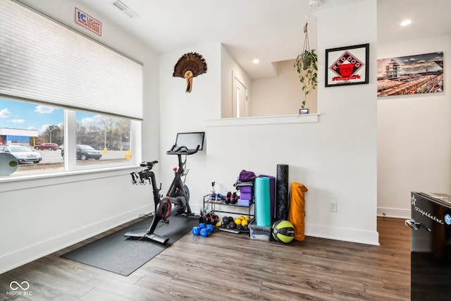 exercise area with wood-type flooring