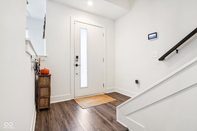 foyer entrance with dark hardwood / wood-style floors