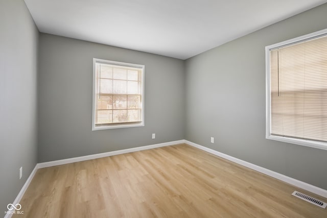 unfurnished room featuring light hardwood / wood-style flooring