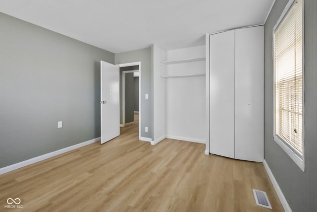 unfurnished bedroom featuring light wood-type flooring