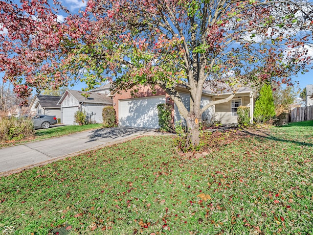 view of front of home with a garage and a front yard