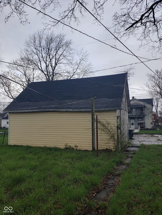 view of side of property with a yard