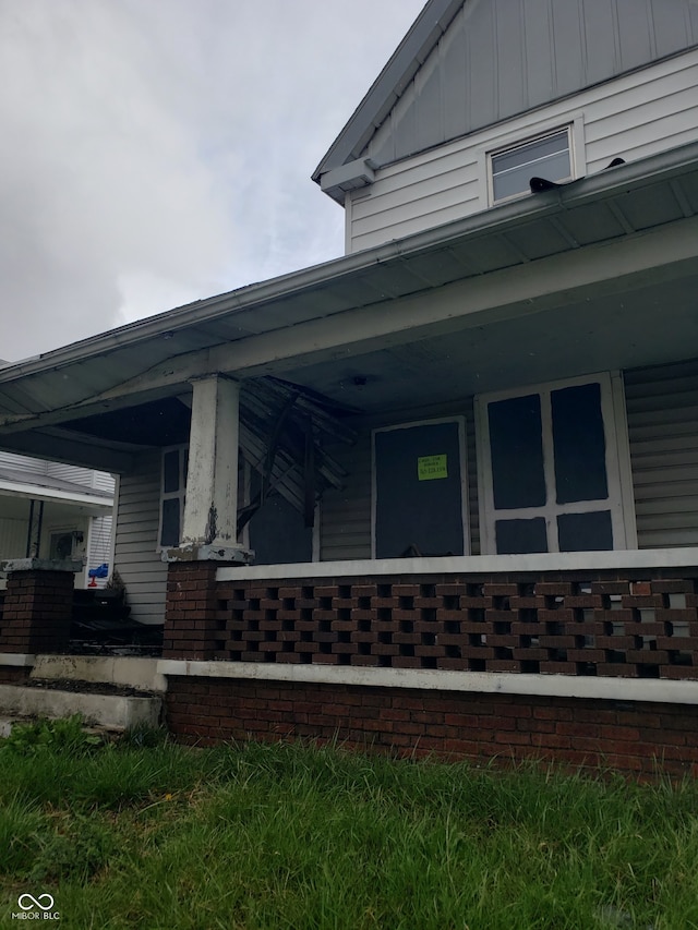 view of property exterior featuring covered porch