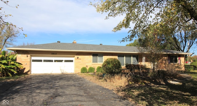 single story home featuring a garage