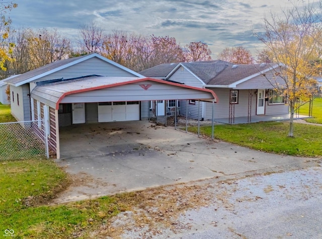 ranch-style house with a front yard, covered porch, and a carport