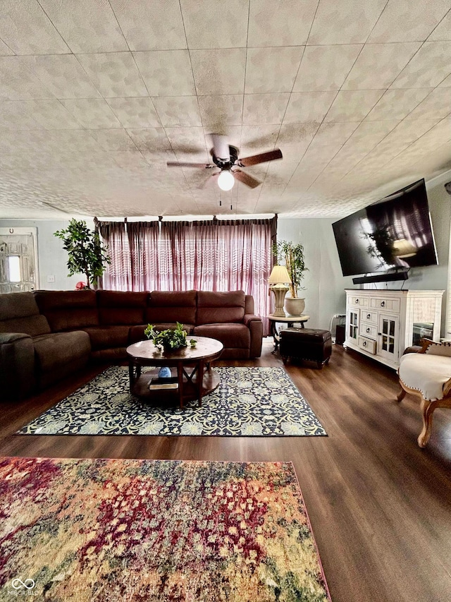 living room with wood-type flooring and ceiling fan