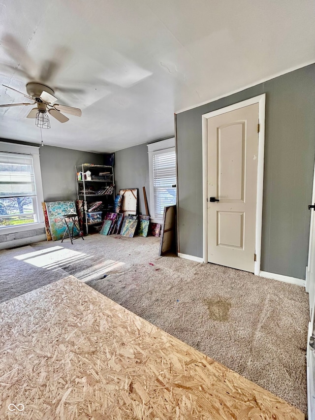 bedroom featuring ceiling fan and carpet floors