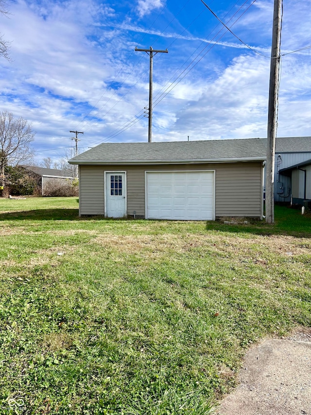 garage featuring a yard