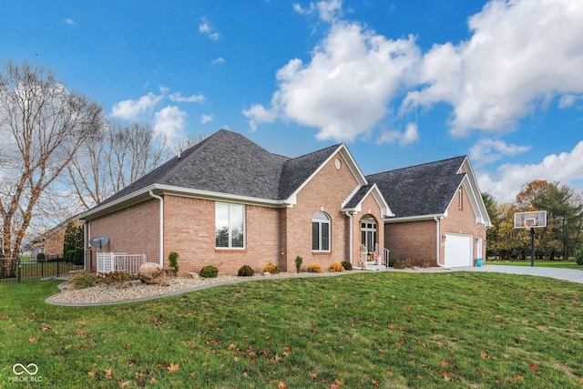 ranch-style home with a front lawn and a garage